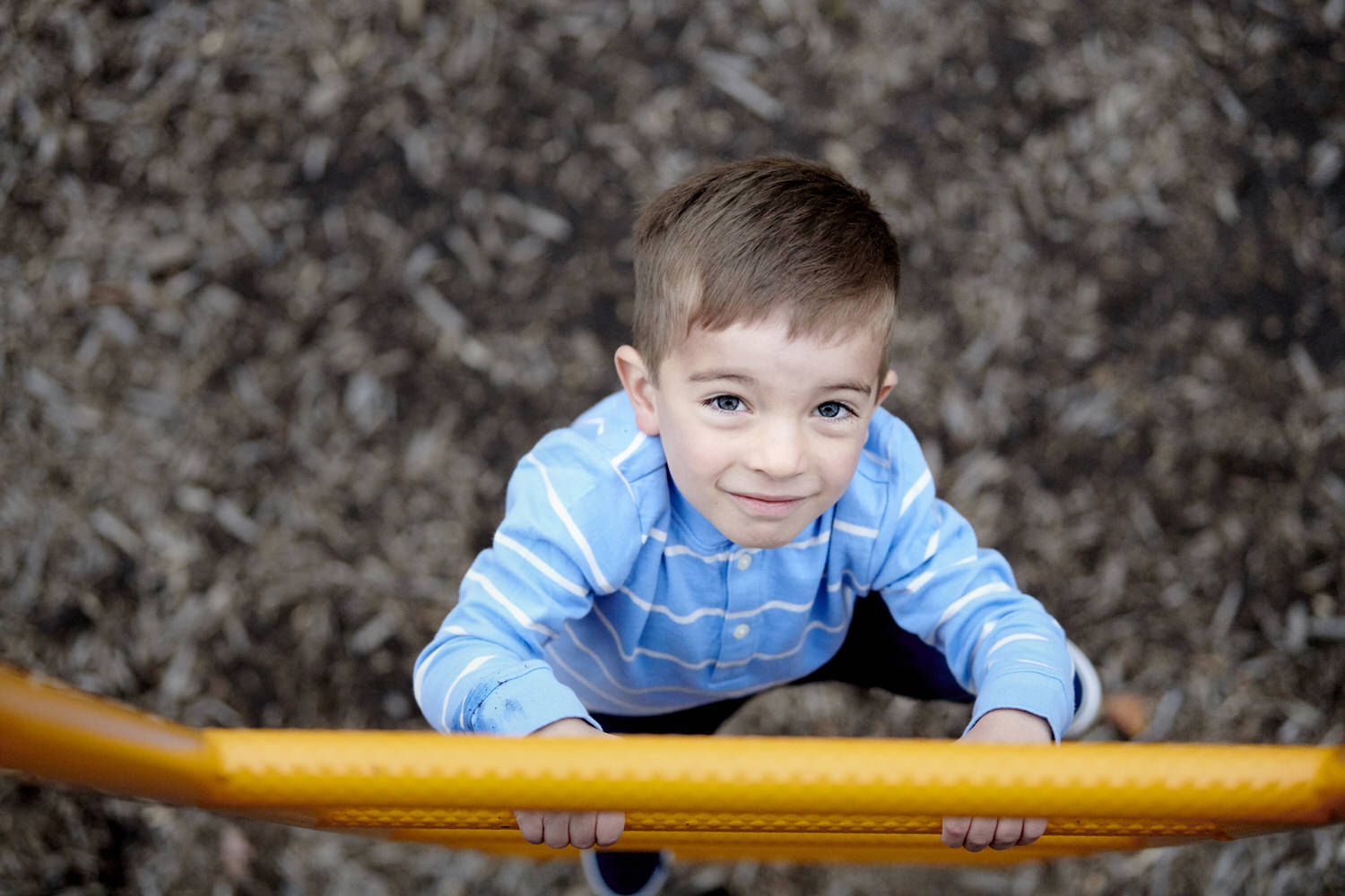 little boy climbing