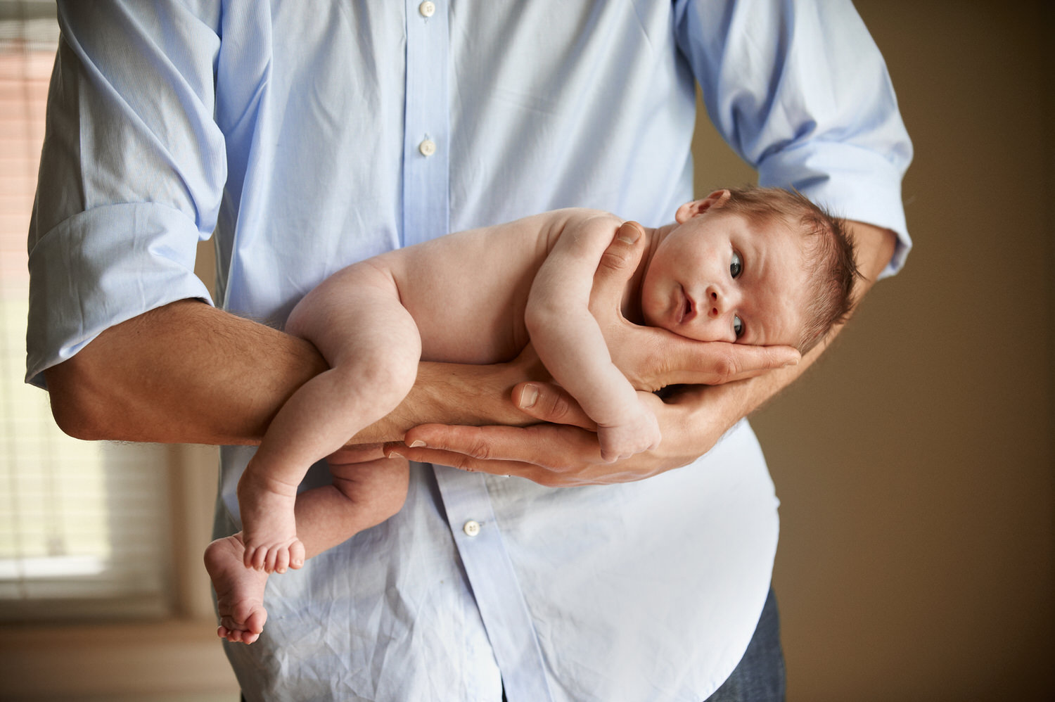 newborn being held