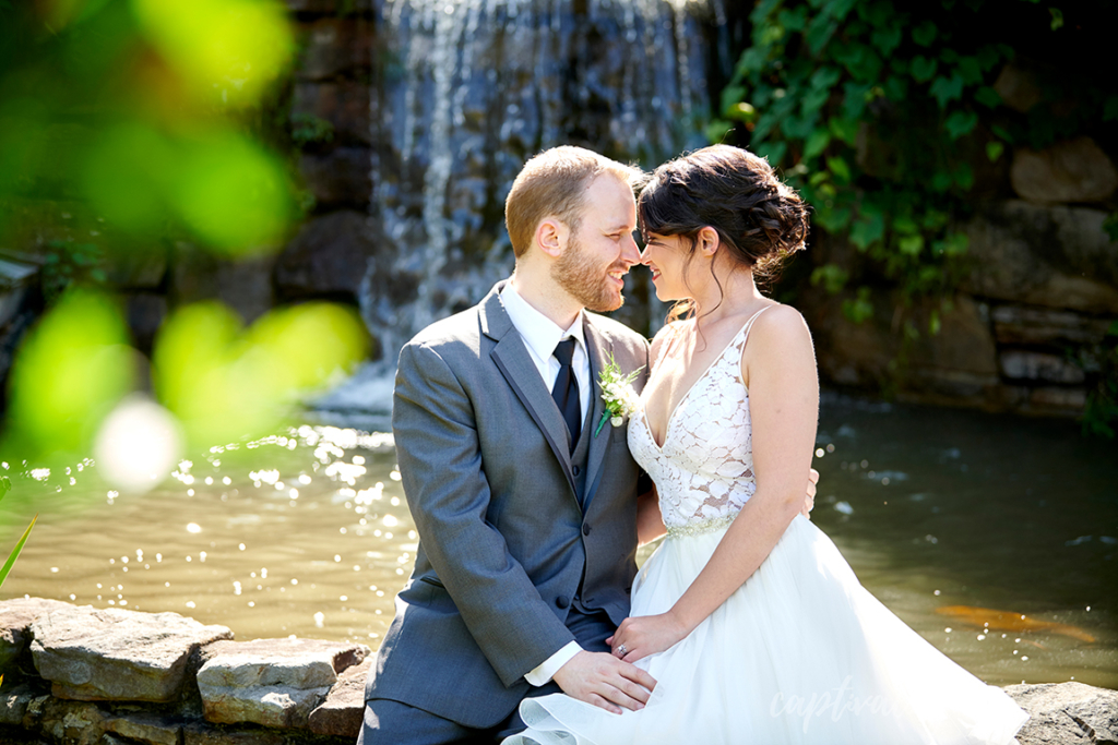 groom and bride look at eachother