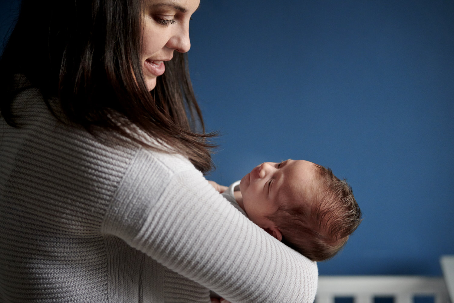 mom holding baby