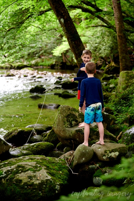 boys playing in creek