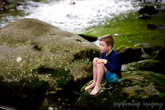 boy with creek in background