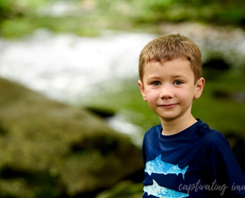 boy with creek in background