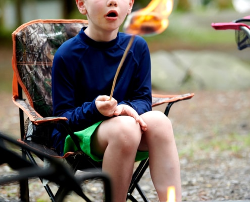 boy with marshmallow on fire