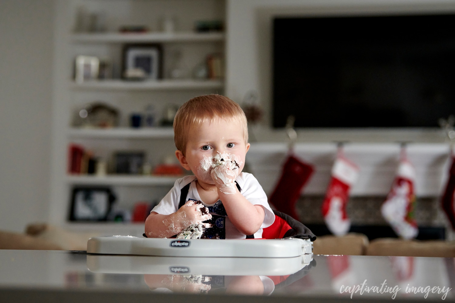 Enjoying his first cupcake -