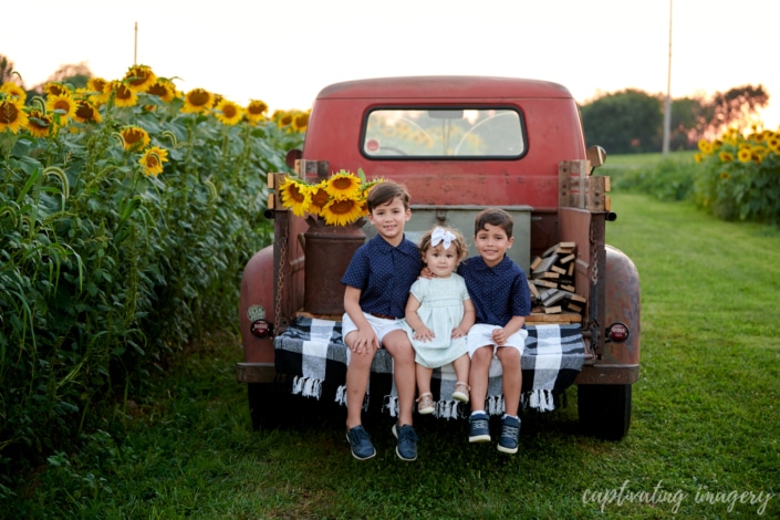 vintage red truck portraits - Now booking sunflower sessions for a limited time